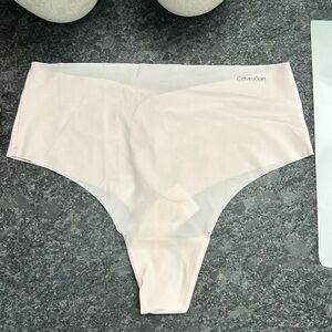 Calvin Klein seamless thong underwear. High rise light pink thong panties